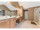 Spacious bathroom features a double vanity, tiled floors, and separate glass-enclosed shower at 150 Fitzroy Ln, Acworth, GA 30101