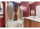 Bathroom with shower-tub combination, cherry walls, and single vanity at 150 Fitzroy Ln, Acworth, GA 30101