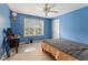 Bedroom features blue walls, ceiling fan and a window at 150 Fitzroy Ln, Acworth, GA 30101