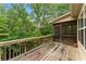 Wooden deck overlooks the backyard, providing a peaceful outdoor retreat and serene views at 150 Fitzroy Ln, Acworth, GA 30101