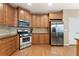 Modern kitchen with stainless steel appliances, light wood cabinets, and ample counter space at 150 Fitzroy Ln, Acworth, GA 30101