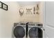 Laundry room features stainless steel washer and dryer at 150 Fitzroy Ln, Acworth, GA 30101
