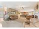 Open-concept living room with fireplace and seamless flow into the adjacent kitchen at 150 Fitzroy Ln, Acworth, GA 30101