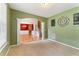 Living room with wall decor and an archway to the stairs and formal dining room at 150 Fitzroy Ln, Acworth, GA 30101