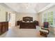 Large main bedroom with a tray ceiling, a big window and ensuite bath at 150 Fitzroy Ln, Acworth, GA 30101