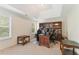 Dedicated home office with built-in shelving, a comfortable chair, and lots of natural light at 150 Fitzroy Ln, Acworth, GA 30101