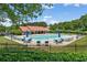 Community pool with lounge chairs, umbrellas, and pavilion, perfect for relaxation and socializing at 150 Fitzroy Ln, Acworth, GA 30101