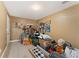 Storage room with neutral walls and carpeted floors; cluttered with household items at 150 Fitzroy Ln, Acworth, GA 30101