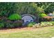 Attractive community entrance sign for Lakefield Forest with stone masonry and colorful landscaping at 210 Chandler Ct, Sugar Hill, GA 30518