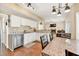 Open kitchen features stainless steel appliances and breakfast nook at 210 Chandler Ct, Sugar Hill, GA 30518