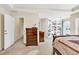 The main bedroom has built-in shelving, carpet flooring, and natural light, providing a welcoming atmosphere at 210 Chandler Ct, Sugar Hill, GA 30518
