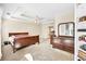 The spacious main bedroom has carpet floors, built-in shelving and large dresser for maximum storage at 210 Chandler Ct, Sugar Hill, GA 30518