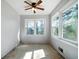 Bright bedroom featuring large windows and a ceiling fan at 34 Cedar Creek Ct, Acworth, GA 30101