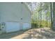 Spacious two-car garage offers ample parking and storage with driveway at 34 Cedar Creek Ct, Acworth, GA 30101