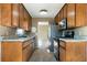 Efficient kitchen layout with ample cabinet space and modern stainless steel appliances at 34 Cedar Creek Ct, Acworth, GA 30101