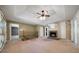 Another angle of a spacious living room featuring a cozy fireplace and ample natural light from large windows at 34 Cedar Creek Ct, Acworth, GA 30101