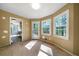 Bright room with hardwood floors, adjacent to the kitchen and featuring a door to the outside at 34 Cedar Creek Ct, Acworth, GA 30101