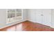 Bedroom featuring a large window and a double-door closet at 7806 Poppy Seed Pl, Winston, GA 30187