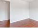 Light-filled room with beautiful wood-look flooring and neutral paint at 7806 Poppy Seed Pl, Winston, GA 30187