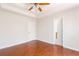 Bedroom with wood floors, neutral walls, tray ceiling, and an ensuite bathroom at 7806 Poppy Seed Pl, Winston, GA 30187