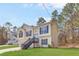 Attractive two-story home with neat landscaping, a two-car garage, and convenient side stairs to the entrance at 7806 Poppy Seed Pl, Winston, GA 30187