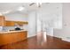 Inviting living space with hardwood floors adjoining the kitchen area with modern appliances and granite countertops at 7806 Poppy Seed Pl, Winston, GA 30187