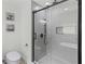 Modern bathroom with a gray tiled shower and toilet with bidet at 225 Valley Dr, Roswell, GA 30075