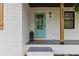 Charming home entrance featuring a light blue front door and brick facade with the house number clearly displayed at 225 Valley Dr, Roswell, GA 30075