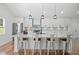 Modern kitchen with stainless steel appliances, a spacious quartz countertop island, and ample cabinet space at 225 Valley Dr, Roswell, GA 30075