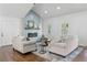Cozy living room showcasing a modern fireplace, comfortable seating, and hardwood floors, perfect for relaxing at 225 Valley Dr, Roswell, GA 30075