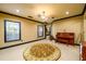 Spacious basement featuring a piano, neutral carpeting, and large windows offering natural light at 50 S Underwood Dr, Covington, GA 30016