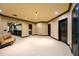 Spacious basement featuring neutral carpeting, dark trim, and a convenient wet bar area for entertaining at 50 S Underwood Dr, Covington, GA 30016
