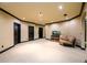 Finished basement area, featuring multiple doors, neutral walls, and plush carpet at 50 S Underwood Dr, Covington, GA 30016