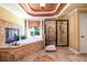 Elegant bathroom with soaking tub, glass enclosed shower, and decorative tile accents at 50 S Underwood Dr, Covington, GA 30016