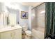 Neutral bathroom with cream colored fixtures, shower and vanity at 50 S Underwood Dr, Covington, GA 30016