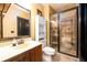 Updated bathroom featuring neutral tile accents and sleek glass enclosed shower at 50 S Underwood Dr, Covington, GA 30016