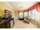 Upstairs bonus room with a mini-fridge, TV, and a sitting chair at 50 S Underwood Dr, Covington, GA 30016