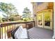 Cozy covered deck with a comfortable bench, perfect for relaxation at 50 S Underwood Dr, Covington, GA 30016