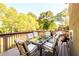 Large wooden deck with outdoor seating area overlooking a lush backyard at 50 S Underwood Dr, Covington, GA 30016