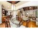 Open-concept dining room with hardwood floors connecting to the kitchen and living area at 50 S Underwood Dr, Covington, GA 30016