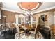 Formal dining room with a round table, chandelier, and elegant decor at 50 S Underwood Dr, Covington, GA 30016