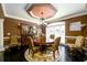 Formal dining room with a round table, chandelier, and elegant decor at 50 S Underwood Dr, Covington, GA 30016