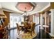 Formal dining room with a round table, chandelier, and elegant decor at 50 S Underwood Dr, Covington, GA 30016