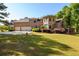 Beautiful home exterior with well-maintained lawn and attached three-car garage at 50 S Underwood Dr, Covington, GA 30016
