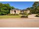 Charming brick home with a well-kept lawn, beautiful landscaping, and a circular driveway enhancing curb appeal at 50 S Underwood Dr, Covington, GA 30016