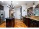 Modern kitchen featuring a center island, granite counters, and stainless steel appliances at 50 S Underwood Dr, Covington, GA 30016