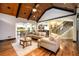 Inviting living room with coffered ceilings, hardwood floors, and an open layout to kitchen and dining at 50 S Underwood Dr, Covington, GA 30016