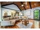 Comfortable living room featuring a tray ceiling, hardwood floors, natural light, and modern finishes at 50 S Underwood Dr, Covington, GA 30016