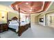 Spacious main bedroom with a sitting area, trey ceiling, and en-suite bathroom at 50 S Underwood Dr, Covington, GA 30016