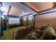Home media room has cozy theater seating with a large screen and custom lighting for an immersive experience at 50 S Underwood Dr, Covington, GA 30016